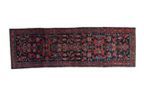 Vintage Persian Mehreban runner, deep navy field with allover red and blue blossom motifs.