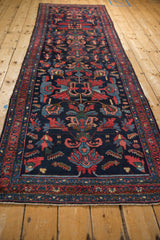 Traditional vintage Mehreban rug detail: navy field with red, sky blue blossom and shrimp motifs.