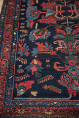 Vintage Mehreban runner with navy field, rose shrimp-like motifs, and geometric banded border.