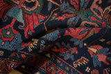 Folded vintage Mehreban runner pile, displaying navy, rose, and sky blue floral and vine motifs.