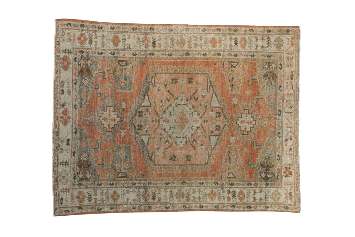 Vintage distressed Persian Veece rug with a hexagonal medallion in terracotta, silver, and sandalwood.