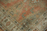 Worn pile of a vintage Veece rug with terracotta and silver hook-and-latch motifs.
