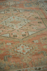 Softly worn pile on a vintage Veece rug with rose, silver, and charcoal geometric motifs.