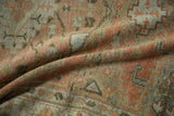 Evenly worn pile of a vintage Veece rug in rose and silver, shown in a soft, shadowed fold.
