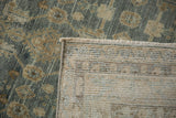 Hand-knotted back weave and distressed wool pile of a vintage Hamadan rug corner.