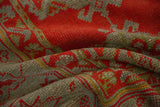 Detailed view of the even low pile and knot structure of an antique red and slate Oushak carpet.