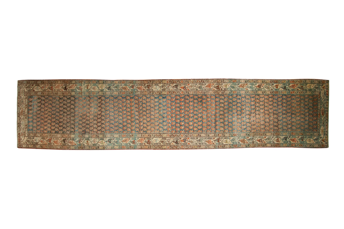 Vintage Serbend rug runner with alternating rows of botehs in distressed sapphire blue, rose, and ivory.