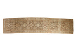 Vintage distressed Afshar runner with diamond medallions in coffee brown, ivory, and pale terracotta.