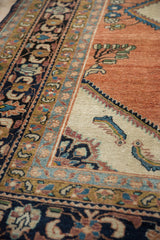 Ivory corner spandrel featuring shrimp-like fish motifs and layered navy, gold, and blue borders.