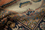 Textured low pile of a vintage Lilihan carpet with a blue fish motif and a navy and rose border.
