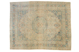 Vintage distressed Persian Meshed rug with a lace-like medallion in soft dusty blue, ivory, and rust.