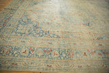 Angled view over the time-softened pile of a distressed Meshed carpet in sky blue and ivory.
