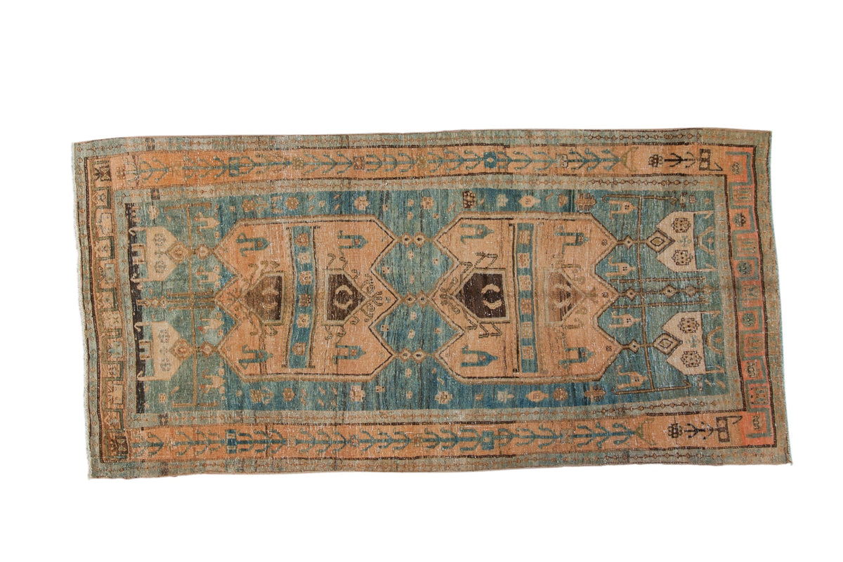 Distressed vintage Bijar rug runner featuring two oversized medallions in dusty rose and abrashed sky blue.
