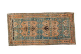 Distressed vintage Bijar rug runner featuring two oversized medallions in dusty rose and abrashed sky blue.