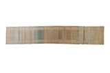 Distressed Mir Sarouk runner with a repeating boteh design and heavy color striations in brown, blue, and ivory.