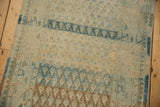 Heavy abrashes and striated dye lots across the low-pile boteh pattern of a vintage Sarouk.