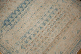 Heavy abrashes and striations across the low pile of a distressed Persian rug runner.