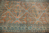 Detailed perspective on the antique Malayer's stepped diamond lattice with terracotta and powder blue motifs.