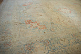 Softly worn texture on a vintage Tabriz rug with decorative slate blue and cinnabar red patterns.