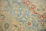 Close-up of the vintage Tabriz pile, showing mostly even wear down to the knot heads.