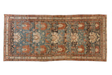 Antique Persian Mehreban runner with repeating oversize palmettes in dusty teal, chestnut, and ivory tones.