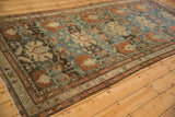 Heavy abrashes and time-softened colors on an antique Mehreban runner with oversize palmette designs.