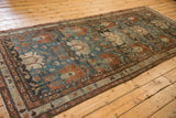 Angled full-length view of the distressed Persian Mehreban runner showing its time-worn patina.