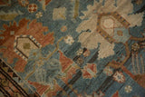 Fine knotting and even wear on the oversized palmette design of an antique rug.