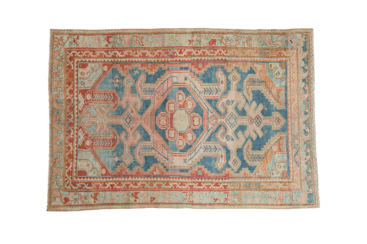 Distressed vintage Malayer rug with abrash blue ground, hexagonal Samovar medallion, geometric red and ivory.