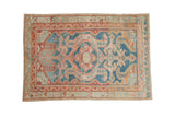 Distressed vintage Malayer rug with abrash blue ground, hexagonal Samovar medallion, geometric red and ivory.