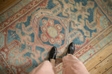 Vintage Distressed Malayer rug, abrashed blue ground with dusty pomegranate red geometric and vine patterns.