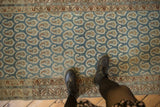 Staggered boteh motifs and time-softened pile on a vintage distressed blue Hamadan runner.