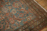 Distressed Malayer rug detail, Herati pattern with visible foundation, dusty teal, madder red tones.