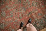 Detailed texture of a distressed Bibikabad rug showing even wear across its sprawling floral design.
