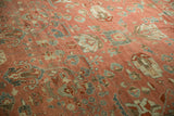 Close detail of a distressed Bibikabad carpet's low pile and sprawling floral pattern.