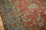 Detail showing the even wear on a vintage Bibikabad carpet's ruby red and dusty teal pile.