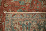 Folded corner of a vintage Bibikabad carpet showing the ruby pile and hand-knotted foundation.