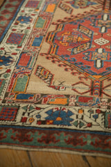 Angled view of the geometric pawn and blossom borders on a vintage Persian Serab runner.