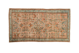 Vintage Distressed Lilihan rug with sprawling floral arabesques in dusty blush, teal, and rust tones.