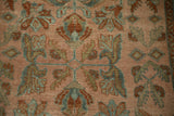 Detailed view of the hand-knotted pile showing even wear to the knot heads.