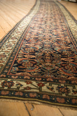 Perspective view of the antique Bijar runner showing the repeating herati design and borders.