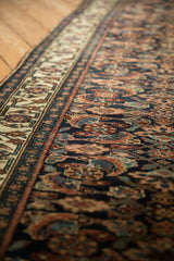 Low pile and exposed knot heads across the herati field of an antique Persian Bijar runner.