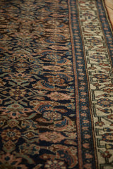 Dense weave of the antique Bijar's herati field against its geometric ivory border.