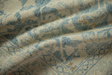 Textured close-up showing worn knot heads and the soft pile of a vintage Hamadan rug.