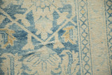Hand repair detail on the worn surface showing exposed knot heads and texture.