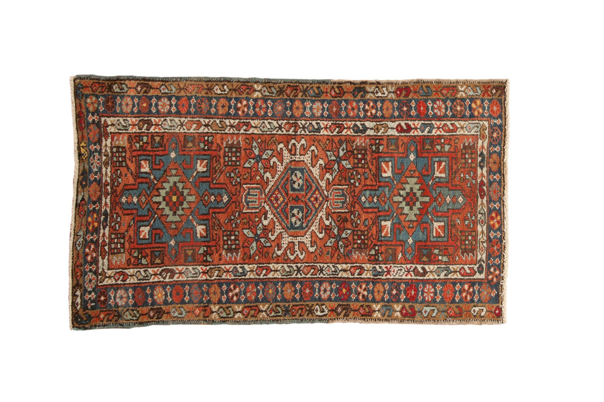 Vintage hand knotted Karaja runner: brick red field, triple geometric medallions, blue, ivory floral.