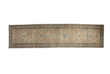 Vintage Persian Heriz runner with a distressed geometric pattern in beige, antique ivory, and powder blue.