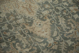 Evenly worn pile of a vintage Tabriz showing geometric vines in dusty teal and sand.