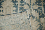 Back view of a vintage Hamadan rug showing its hand-knotted foundation and secured side cord.