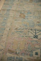 Angled view of the vintage Persian runner's even wear, showing low pile and knot heads.
